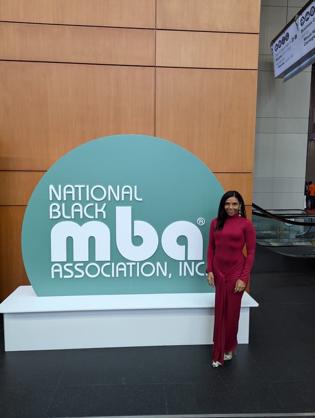 Lisa Francoeur in a red gown at the National Black MBA Association summit