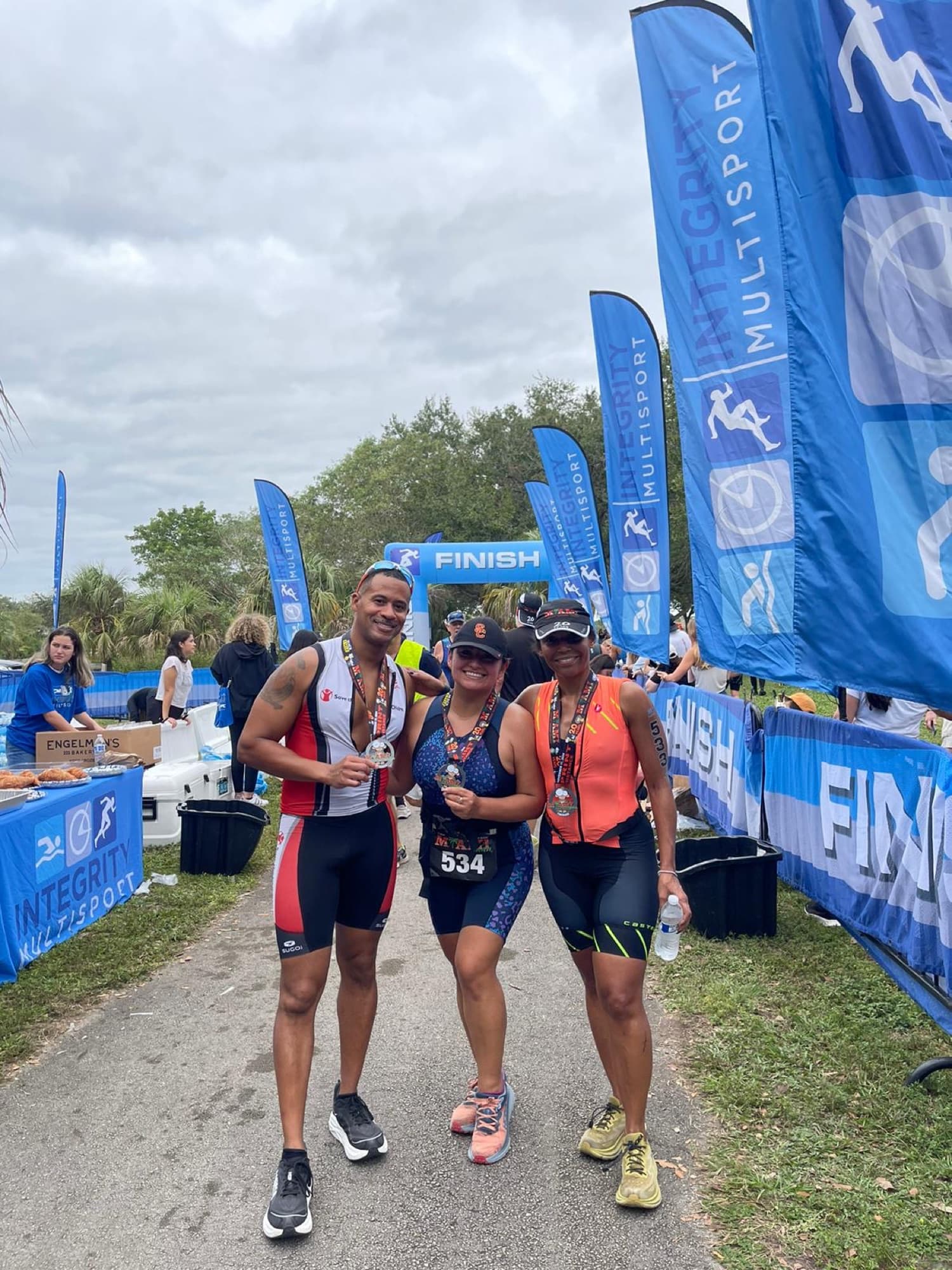 Lisa Francoeur with fellow triathletes at the race finish line